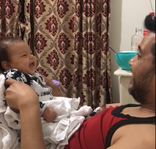 9 week old baby laughing with daddy