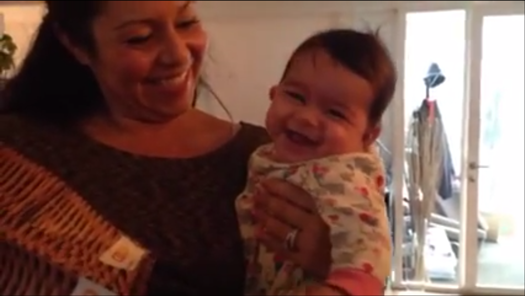 Your Babies #024: Liliana laughing at a paper bag